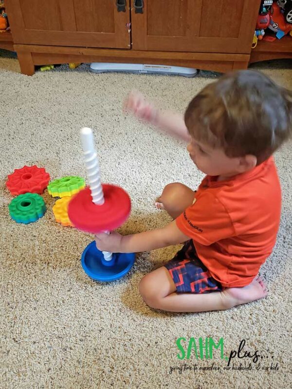 3 year old playing with Fat Brain Toys SpinAgain toy | sahmplus.com