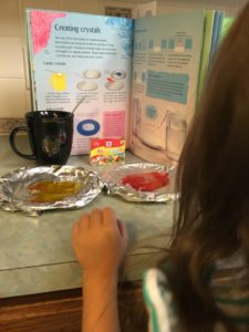 girl science nerd making sugar crystals