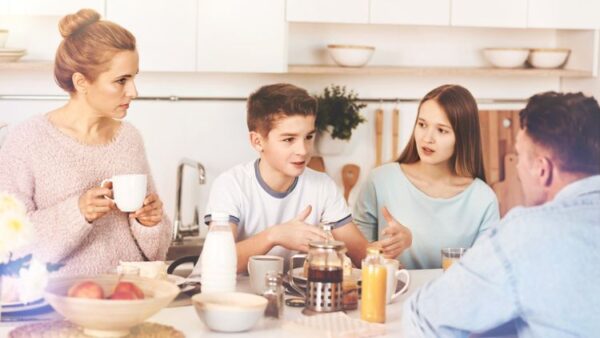 authoritative parenting style in action with family  discussion at breakfast