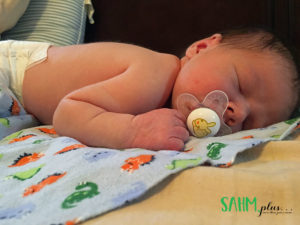 baby asleep on a blanket on tummy | sahmplus.com