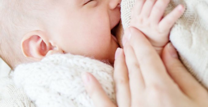 A breastfeeding baby - pin image for How to breastfeed a baby - a collection of the most helpful advice from moms who want you to succeed at breastfeeding your newborn and beyond | www.sahmplus.com