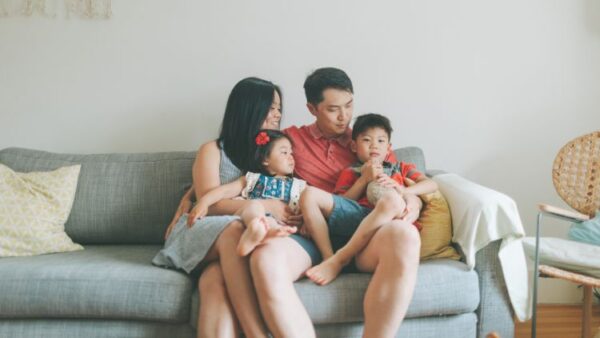 family on couch learning how to changing parenting styles