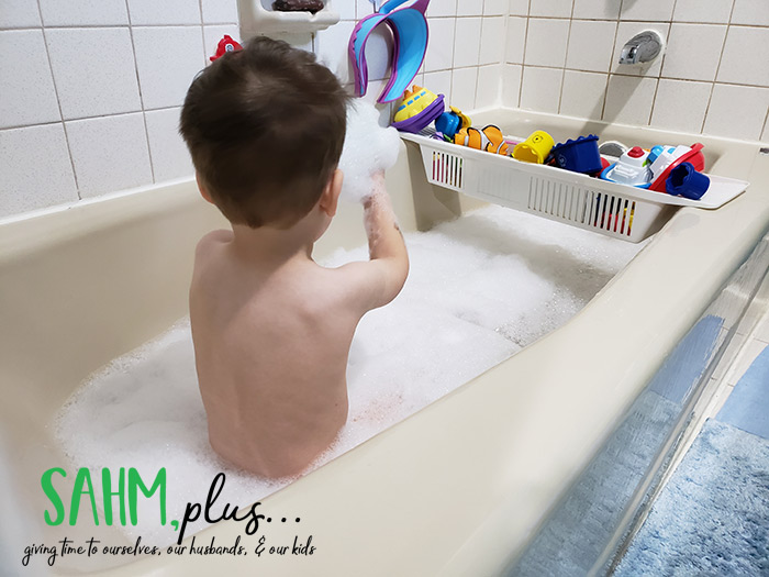child playing in a bubble bath makes an excellent indoor activities for 3 year olds