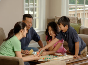 family playing board games safer at home