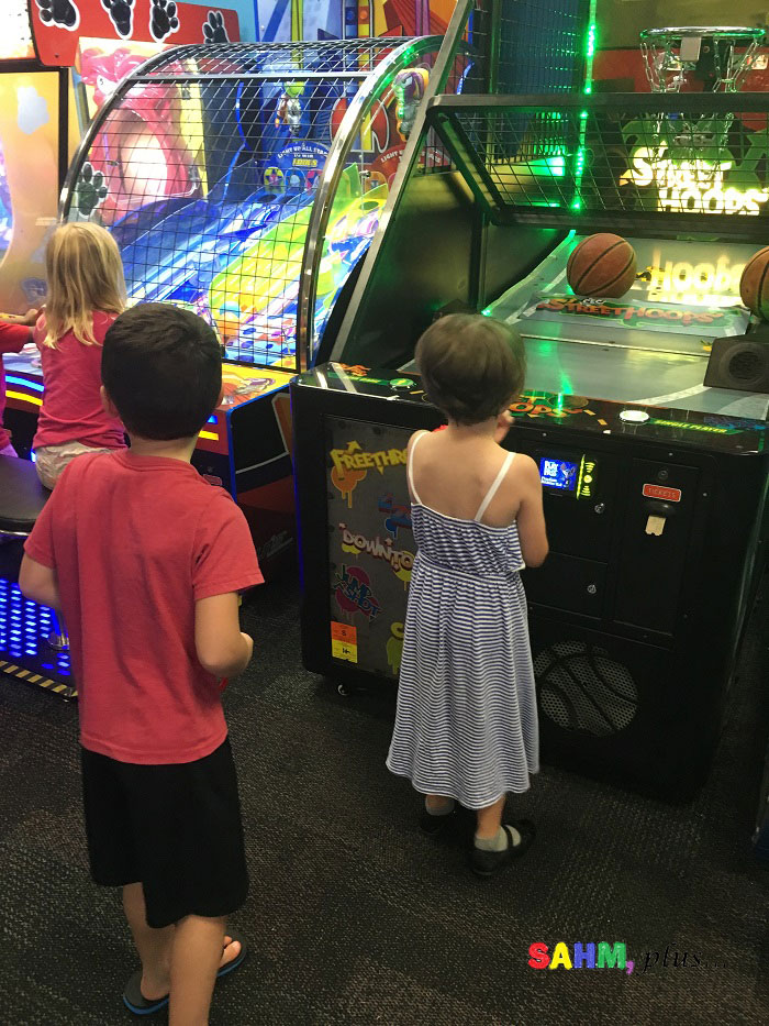 Building healthy friendships - making and keeping friends. Friends taking turns on games at Chuck E Cheese's | www.sahmplus.com