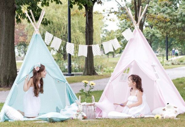 Girls playing in pink and blue Teepee Joy tents
