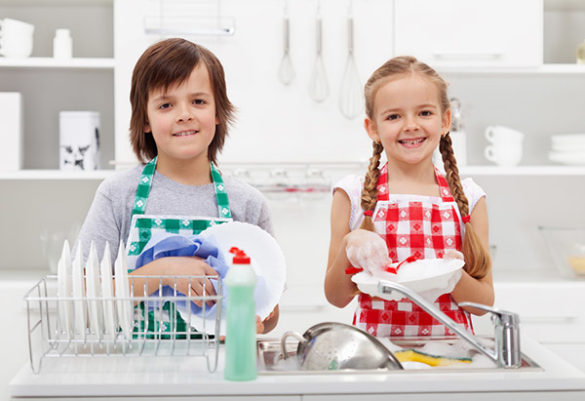 happy kids doing dishes