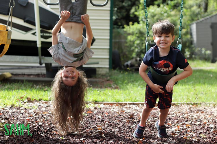 kids outside getting fresh air and sunshine while social distancing during coronavirus pandemic