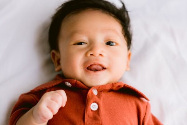 baby boy in brown button up shirt