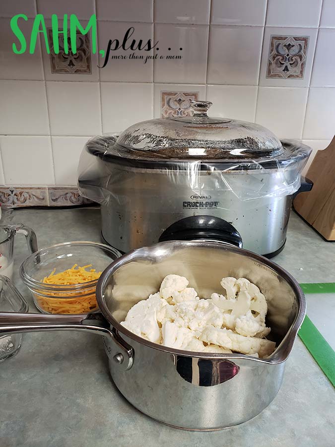 Preparing dinner for the family - pot with cauliflower, crock pot, other food | sahmplus.com