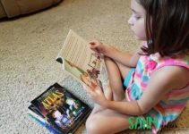 Child reading a book from the conservative children's book collection from The Tuttle Twins | sahmplus.com