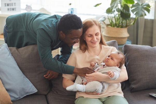 parents tending to fussy baby to discuss signs of sleep regression