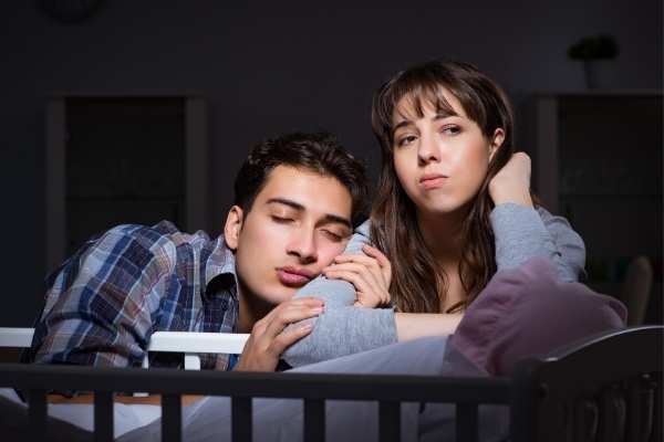 tired parents wondering how long baby sleep regression lasts