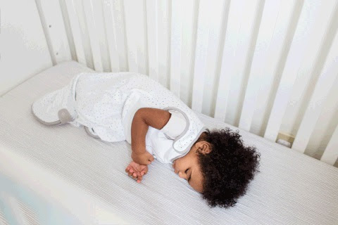 8 month old baby sleeping in crib