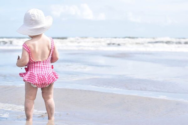 toddler girl on the beach. Is a Disney Cruise with a toddler a good idea?