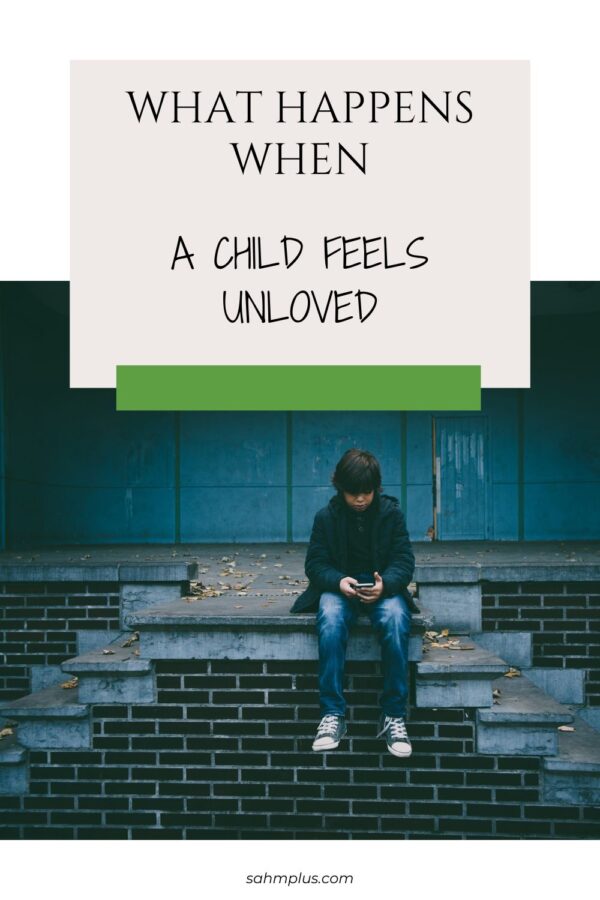 Tall Pinterest image of child sitting alone on steps with smart phone looking sad for article What Happens When a Child Feels Unloved.